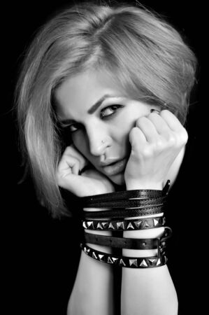 Portrait of attractive young woman with tied handsの写真素材