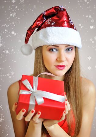 Portrait of beautiful sexy girl with Christmas giftの写真素材