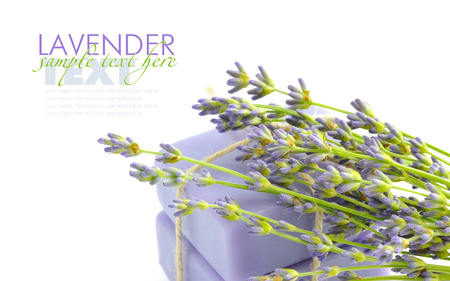 Handmade soap and lavender flowers on a white backgroundの写真素材
