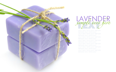 Handmade soap and lavender flowers on a white backgroundの写真素材