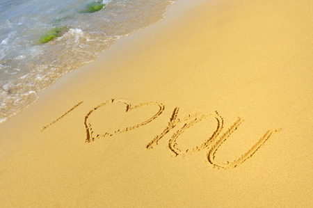 Inscription I love you on a sandy beachの写真素材