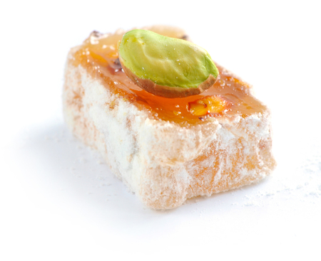 Turkish delight (lokum) with pistachio on a white background, closeupの写真素材