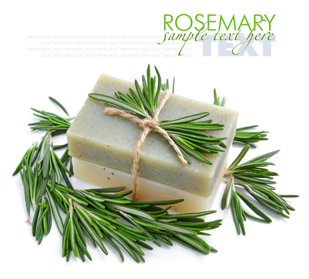 Rosemary Handmade Soap with the branches of rosemary on a white backgroundの写真素材
