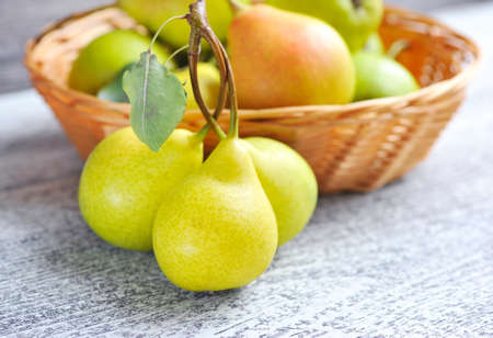 Freshly harvested pears on old wooden backgroundの写真素材