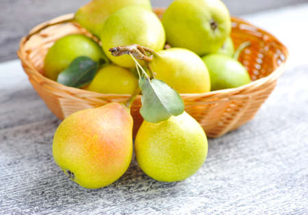 Freshly harvested pears on old wooden backgroundの写真素材