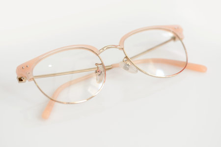 Pink glasses with clear lenses on the white background