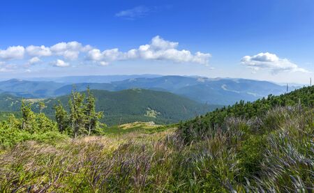 Summer landscape in mountains and blue sky with cloudsの写真素材