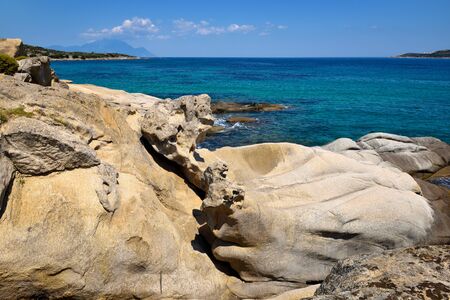 Beautiful seascape with stones and translucent blue waterの写真素材