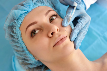Cosmetologist does injections on the face of a beautiful woman in a beauty salon. Cosmetology...