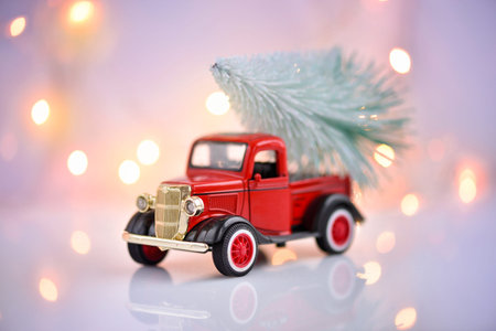 Merry Christmas and Happy New Year Postcard. Retro pickup truck with christmas tree on a festive...
