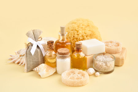 Natural cosmetics and bath accessories: bath salt, cream, bottles of essential oils, soap, sea...