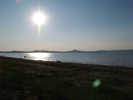 bright sun over the lakeの写真素材
