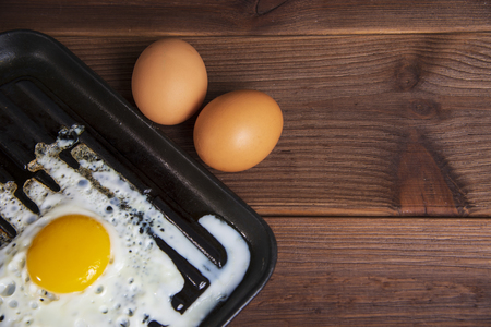 Fried eggsfried egg in a pan, grilled eggs, rawの写真素材
