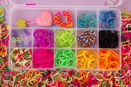 rubber bands for weaving on a colored background.の写真素材