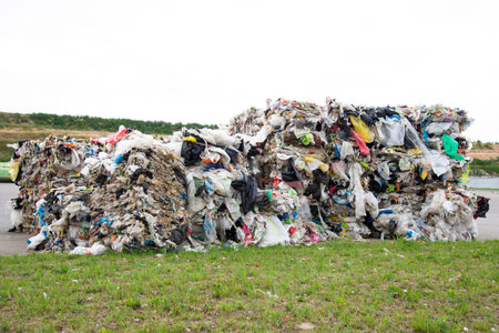 Minsk, Belarus -June 6, 2019 A pile of pressed polyethylene at a garbage collection plant. Sorting...