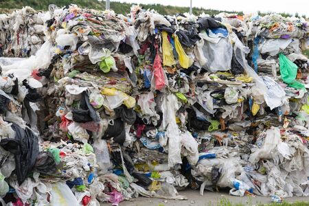 Minsk, Belarus -June 6, 2019 A pile of pressed polyethylene at a garbage collection plant. Sorting and processing of polyethylene. The concept of environmental protection..のeditorial素材