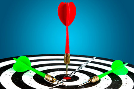 Target with a red arrow in the center and next are green arrows. Hit the target.