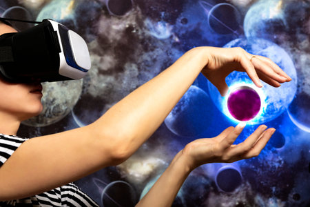 A woman is looking through virtual reality at space. Space background