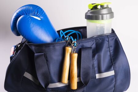 active fitness kit for boxing, boxing gloves, galloping, bandages for hands, cap on a white background, top view.の写真素材