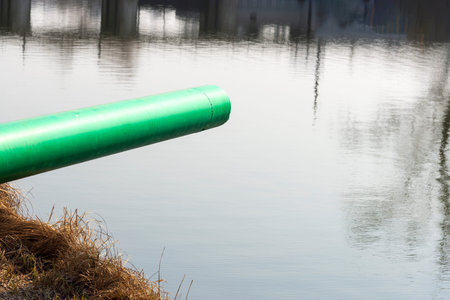 A drain pipe or sewage or sewage discharges waste water into a river. Wastewater or domestic...