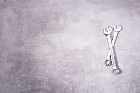 Two metal wrenches on a gray background with place for text, top viewの写真素材
