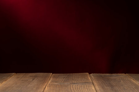 Wooden board empty table in front of a blurred background. Perspective brown wood with a blurry multi-colored background - can be used to showcase or assemble your products. Mock upの写真素材