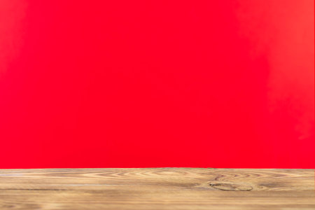 Wooden board empty table in front of a blurred background. Perspective brown wood with a blurry multi-colored background - can be used to showcase or assemble your products. Mock upの写真素材