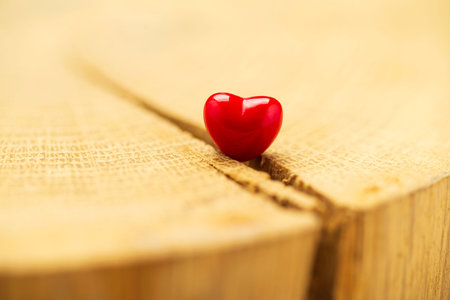 Valentines Day background with hearts. Red heart on old wood. Holidays card with copy space