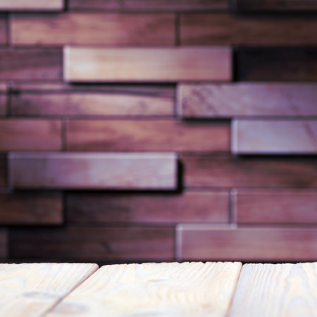 Wooden board empty table in front of blurred background. Perspective brown wood with brick background - can be used to display or assemble your products. Mock up.の写真素材