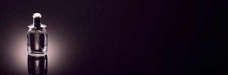 Bottle of women's perfume on a dark background untitled, banner.の写真素材