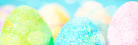 Multicolored Easter eggs as background, banner photo.