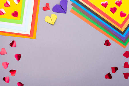 Background for creativity. Colored paper and paper hearts. Cut out of paper.の写真素材