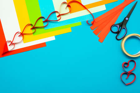 Background for creativity. Colored paper and paper hearts. Cut out of paper.の写真素材