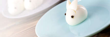 Funny bunny made of boiled eggs, Easter table decoration, Easter decor and servingの写真素材