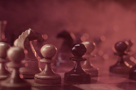 Chess fight, chess pieces on the board, toned in red. Battle fire and smoke