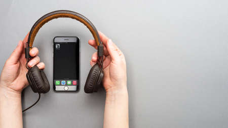 Minsk, Belarus - 02.21.2021: View of the Clubhouse app on a smartphone, a controversy of 2021 hidden behind the Social app. The fall of the club in the audio chat application on the smartphone.のeditorial素材