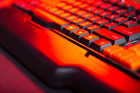 Gaming keyboard from computer close-up with color backlight.の写真素材