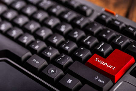 Close-up enter button with inscription support. Computer keyboard close up. Technical support.の写真素材