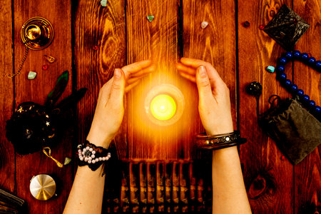 Magic and witchcraft. Occult and Esotericism. Mystical ritual. Divination, female hands with ethnic...