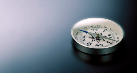 Compass on black board background and a lot of copy space. Concept - compass showing the right...