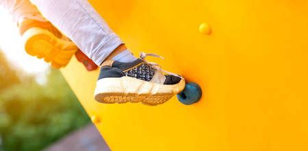 Close up image of a child's foot on a climbing wall.の写真素材