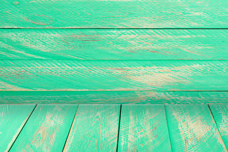 Wooden background - a table with a wooden wall. Wooden table background. Blank display. Vintage mint wood table.の写真素材