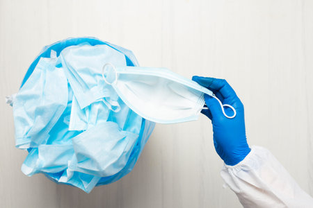 Used hygienic mask in the trash bin, infectious waste, prevented virus covid-19 by separating...
