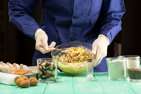 Cooking oatmeal cookies with nuts and candied fruit sweet nutritious dessert.の写真素材