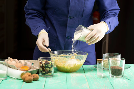 Cooking oatmeal cookies with nuts and candied fruit sweet nutritious dessert.の写真素材