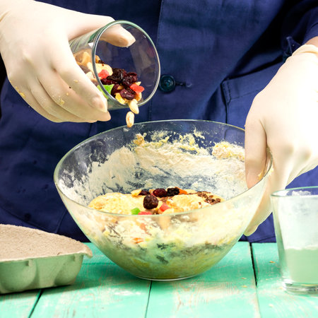 Cooking oatmeal cookies with nuts and candied fruit sweet nutritious dessert.の写真素材