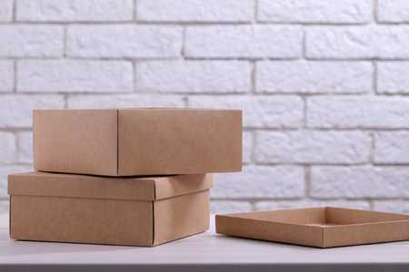 Two kraft cardboard boxes on the tableの写真素材