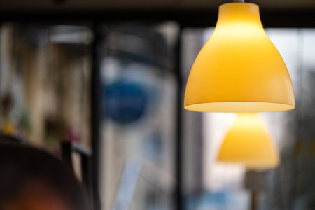 A row of lamps in the interior of the restaurant. Modern lighting fixtures as restaurant interior designの写真素材