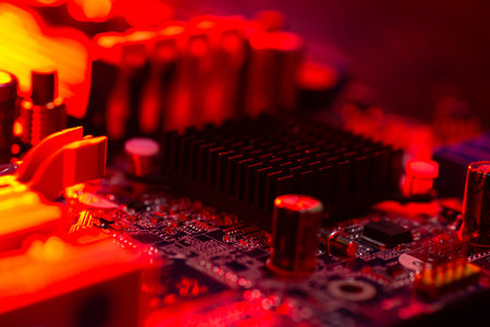 Motherboard close-up with contacts, desktop PC. Computer technology hardware components background.