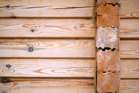 Natural background pattern of log wall. Construction of houses made of wood, profiled timber.の写真素材
